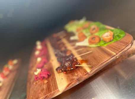 Canapés served on a wooden board