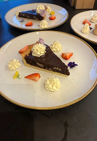 Chocolate torte with berries and cream